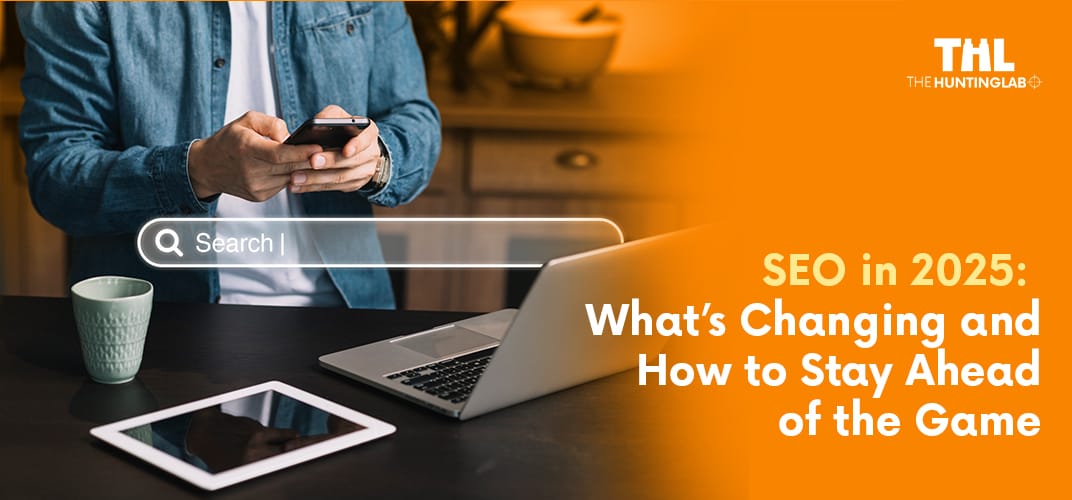 Man using smartphone with laptop and tablet on table, showcasing a search bar overlay with 'SEO in 2025: What’s Changing and How to Stay Ahead of the Game'